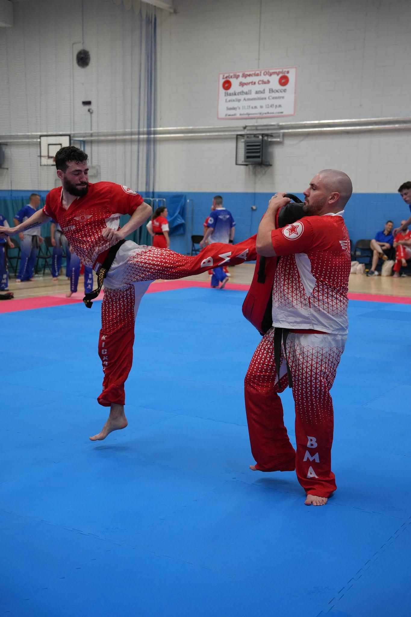 Bushido students working together on kickboxing technique